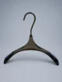 JY19 Amber Acrylic Women's Pointed Wide-Shoulder Hanger — angled view